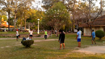 Playing shuttle cock at a park in Siem Reap