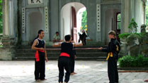 Boys practicing martial arts at the Quan Thanh Temple