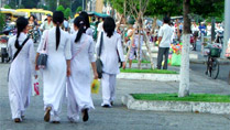 Girls in Ao Dai in central Saigon