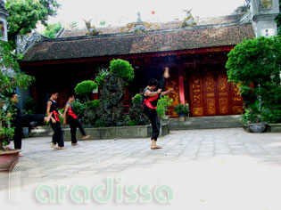 Practicing martial arts at the Quan Thanh Temple
