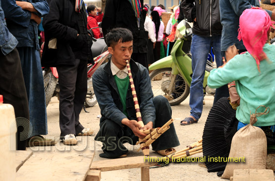 A Hmong man selling Hmong traditional musical instrument