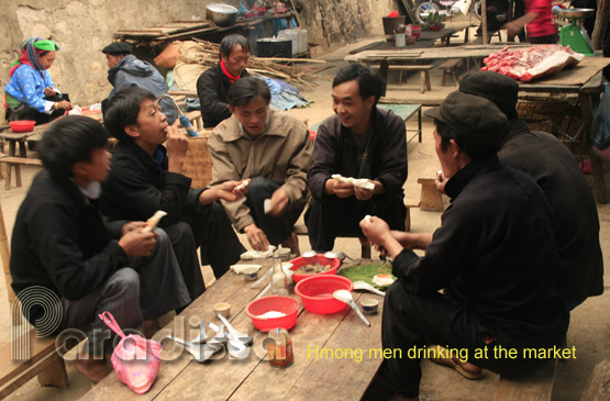 A Hmong men drinking at Dong Van Market
