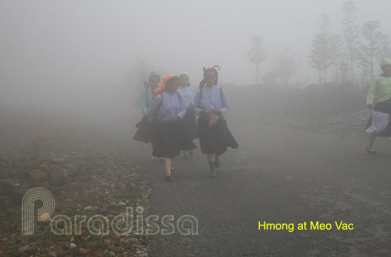 Hmong on a foggy mountain pass at Meo Vac
