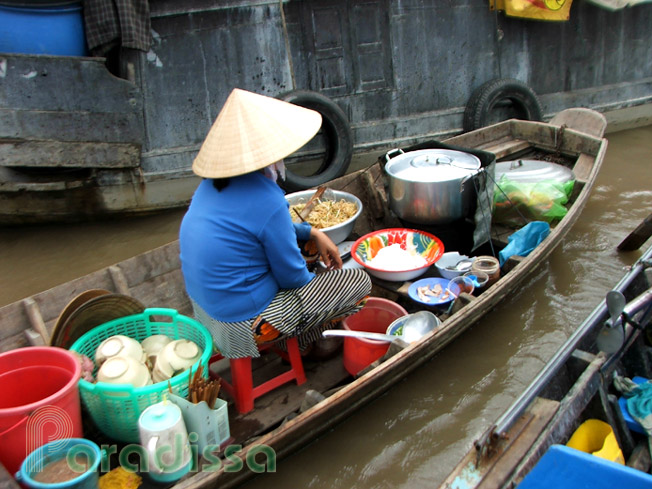 A restaurant boat at Cai Be Floating Market in the Mekong Delta Vietnam