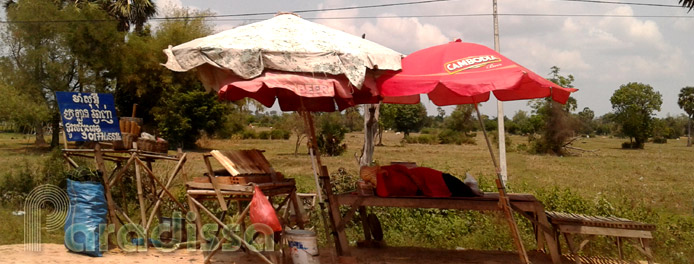 A vendor sleeping by the roadside at Siem Reap