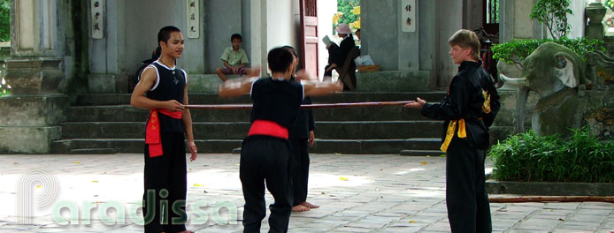 Boys practicing martial arts at the Quan Thanh Temple