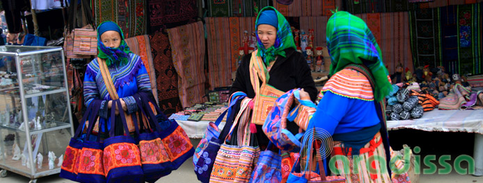 Hmong ladies selling brocade bags at Bac Ha Market