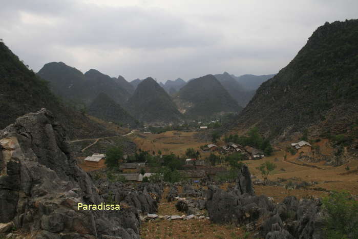 An ethnic market amid amazing landscape at Lung Tao, the Dong Van Plateau, Ha Giang