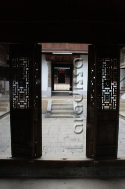 The dark alley leads to different inner sections of the complex The dark alley leads to different inner sections of the complex