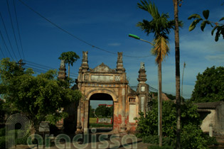 The weathered gate to the village