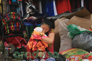 A happy mother and her baby at Can Cau