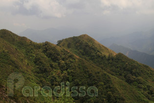 Breathtaking mounain peaks on the way to the summit of Ta Chi Nhu