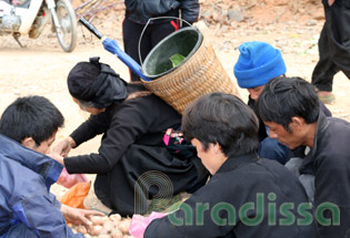 Hmong men buying potatoes at Ma Le Market