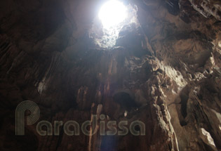 At another corner of the cave, there's an opening on the ceiling which allows magical lights to travel through