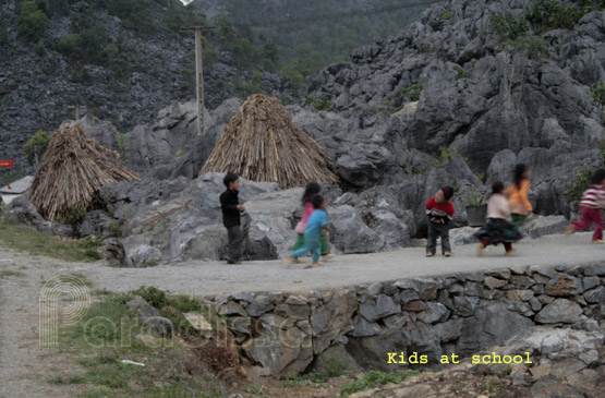 Kids scurrying on sight of a stranger at the Dong Van Rock Plateau