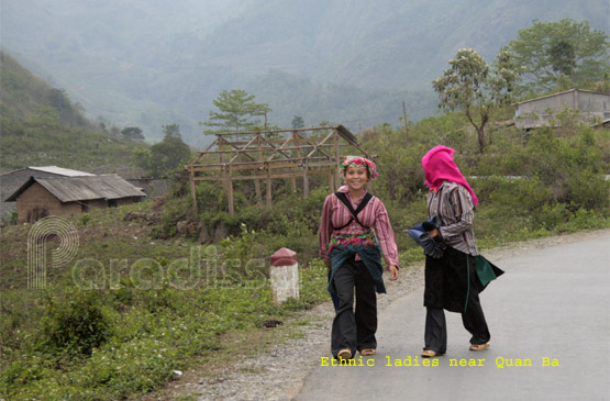 Ethnic ladies on the road near Quan Ba