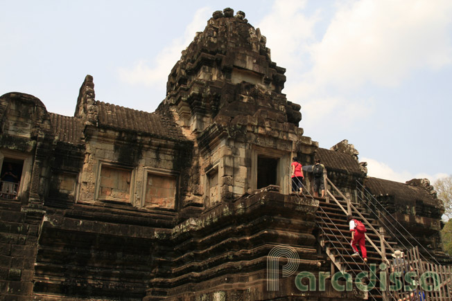Visitors climbing the upper level of the Baphuon Temple, Angkor Thom, Siem Reap, Cambodia