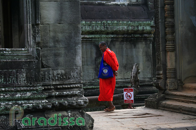 A saffron-clad Buddhist monk at Banteay Samre Temple