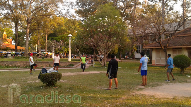 Playing shuttle-cock at at park in Siem Reap City