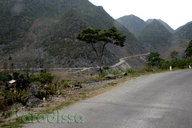 A trail formed by carving into the rock at Dong Van