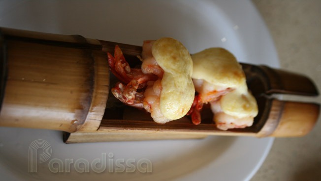 Prawns baked in a bamboo pipe