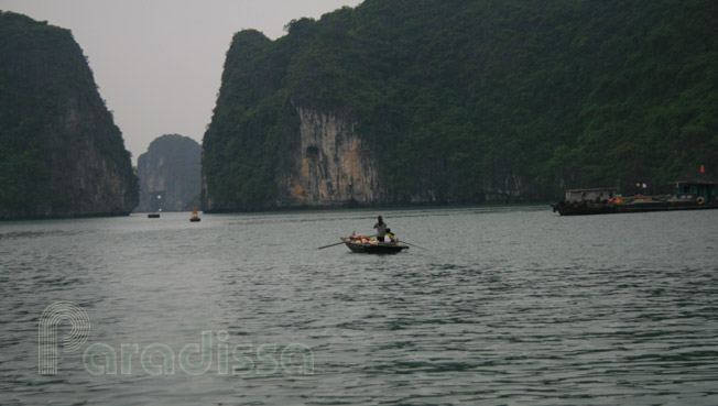 A lady with with kids were rowing somewhere in a hurry