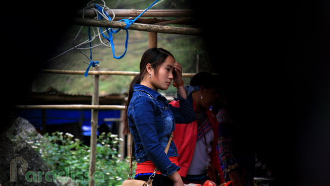 A young Hmong girl selling clothes at Can Cau