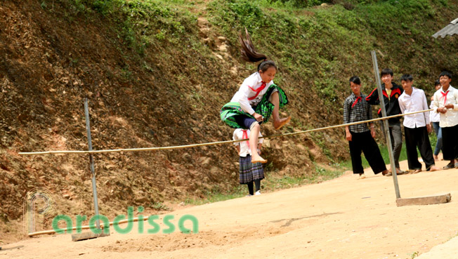 A Hmong school girl doing high jump