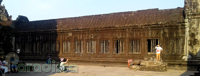 Tourists taking photos at Angkor Wat