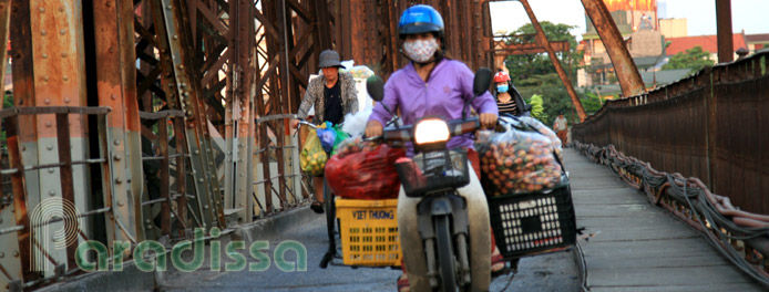 Transport goods on the Long Bien Bridge in Hanoi
