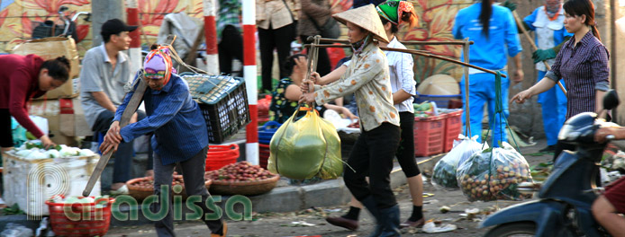 Workers at the Long Bien Market